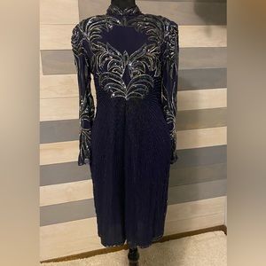 Short silk evening, dress with oilspill and silver beading. By Carina , M.